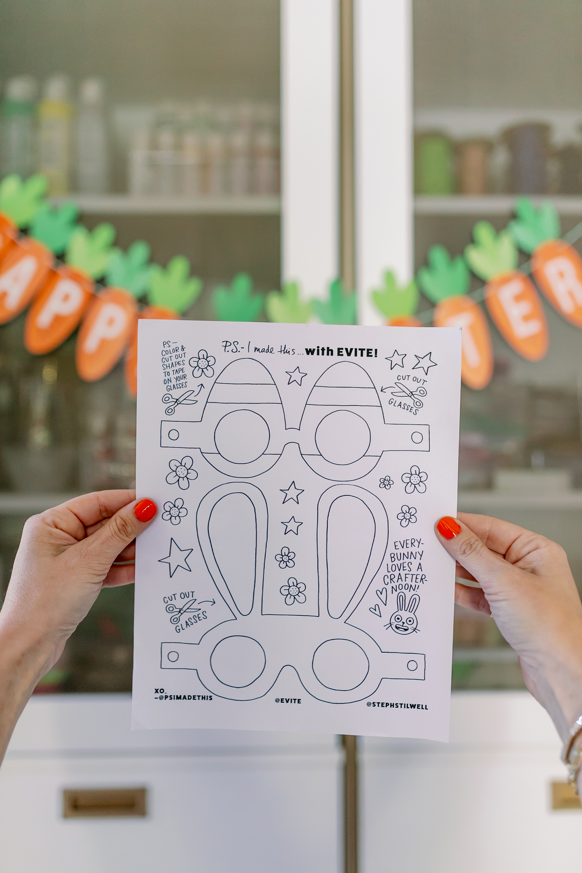 Hands holding up the Easter DIY printable.