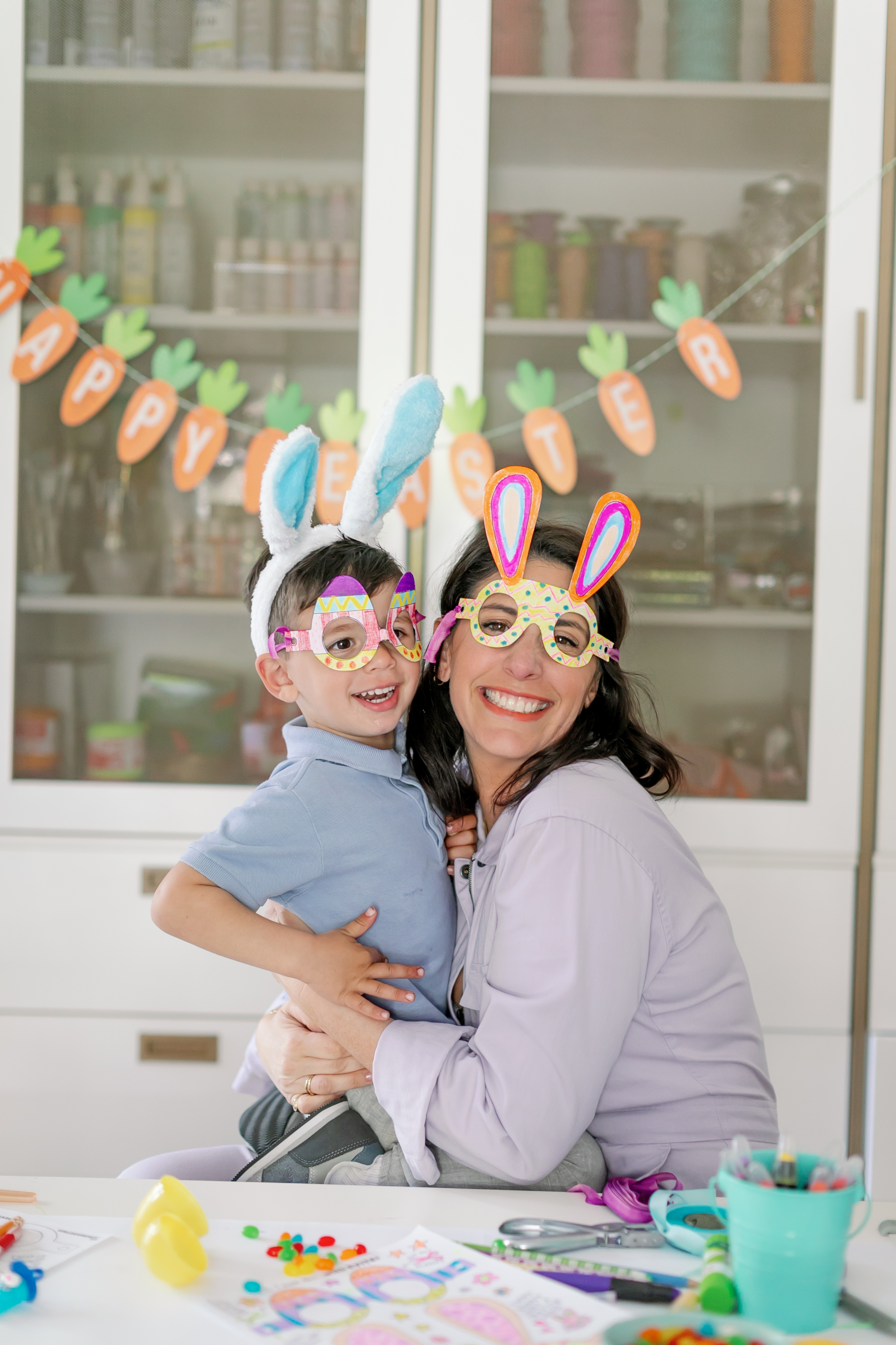 Erica and her son posing together in their Easter glasses.