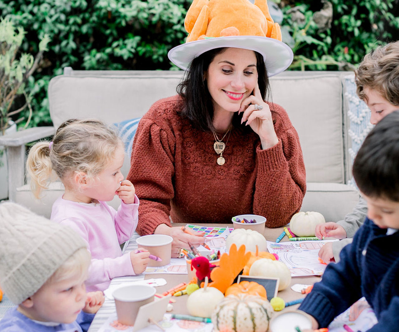 Photo of Erica Domesek at a Kidsgiving party.