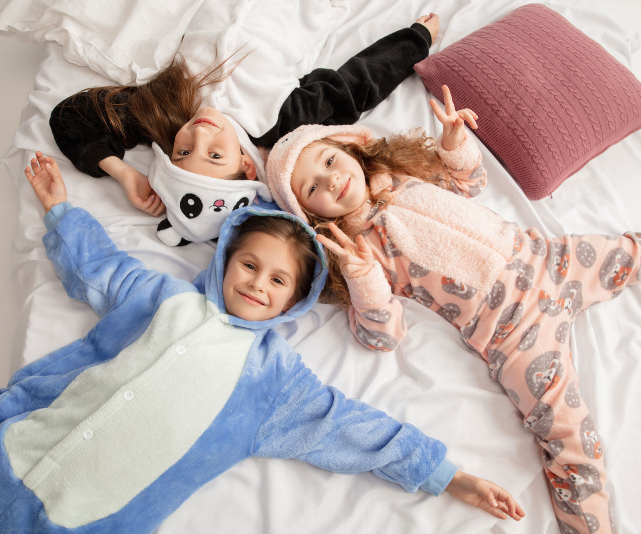 Kids in pajamas hanging out.