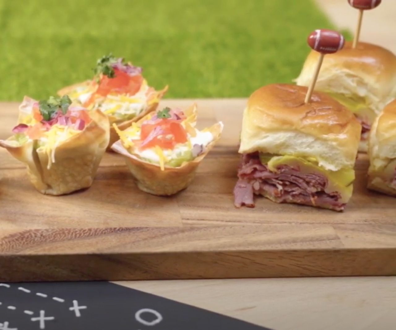Pastrami sliders and bean dip cups.