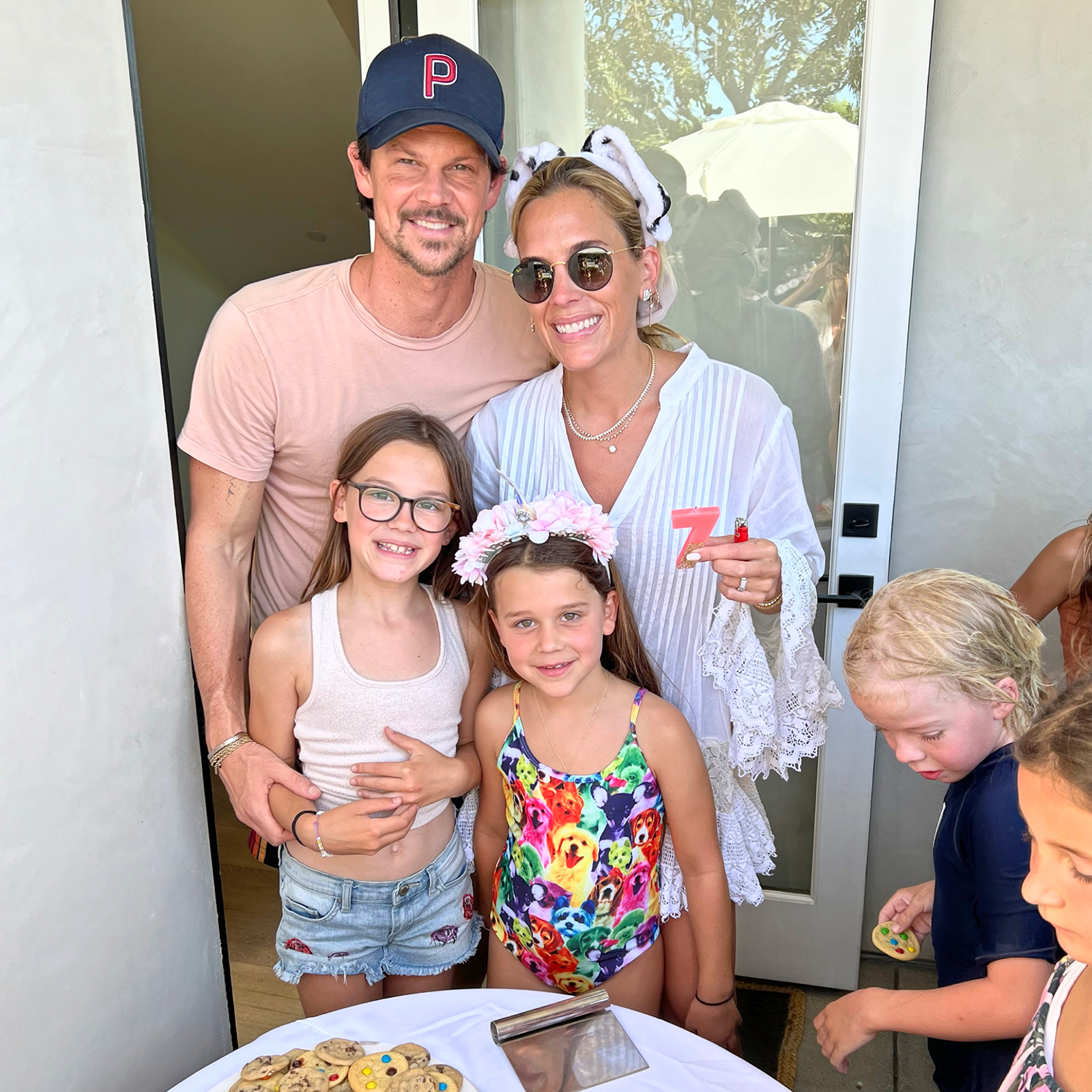 Chloe and her family posing together at the party.