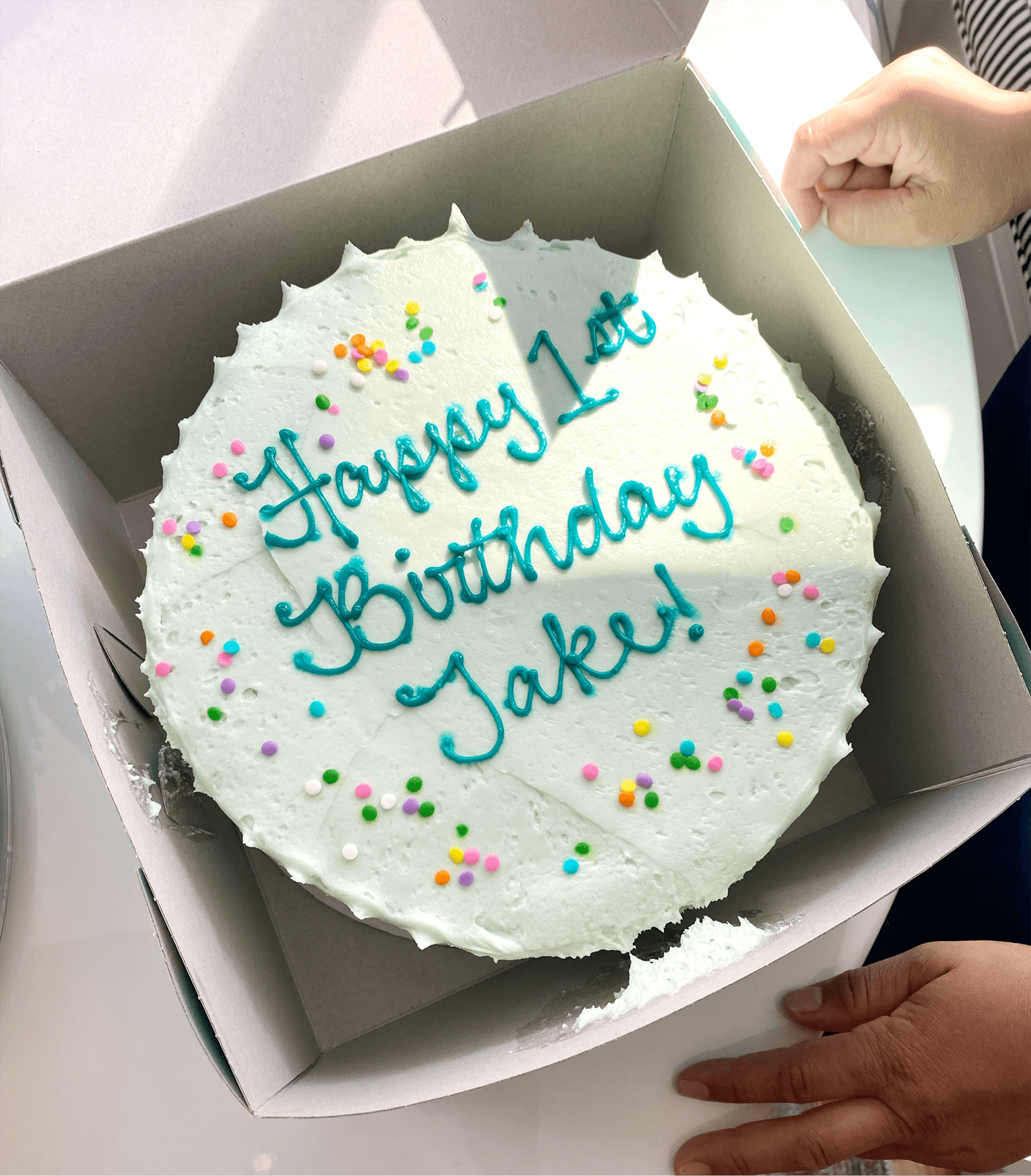 Cake with "Happy 1st Birthday Jake!" written on it.