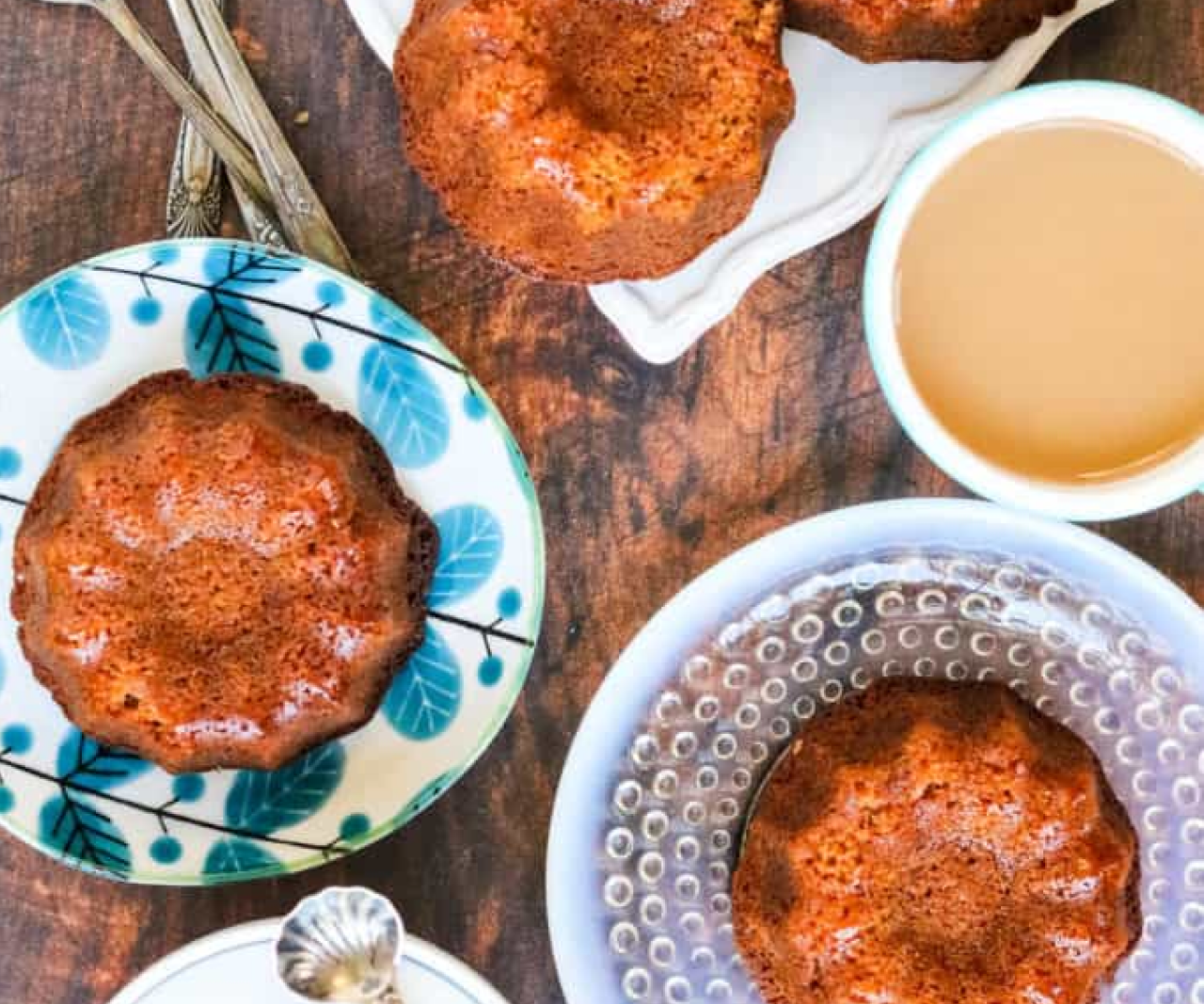 A table with honey cakes on colorful plates.