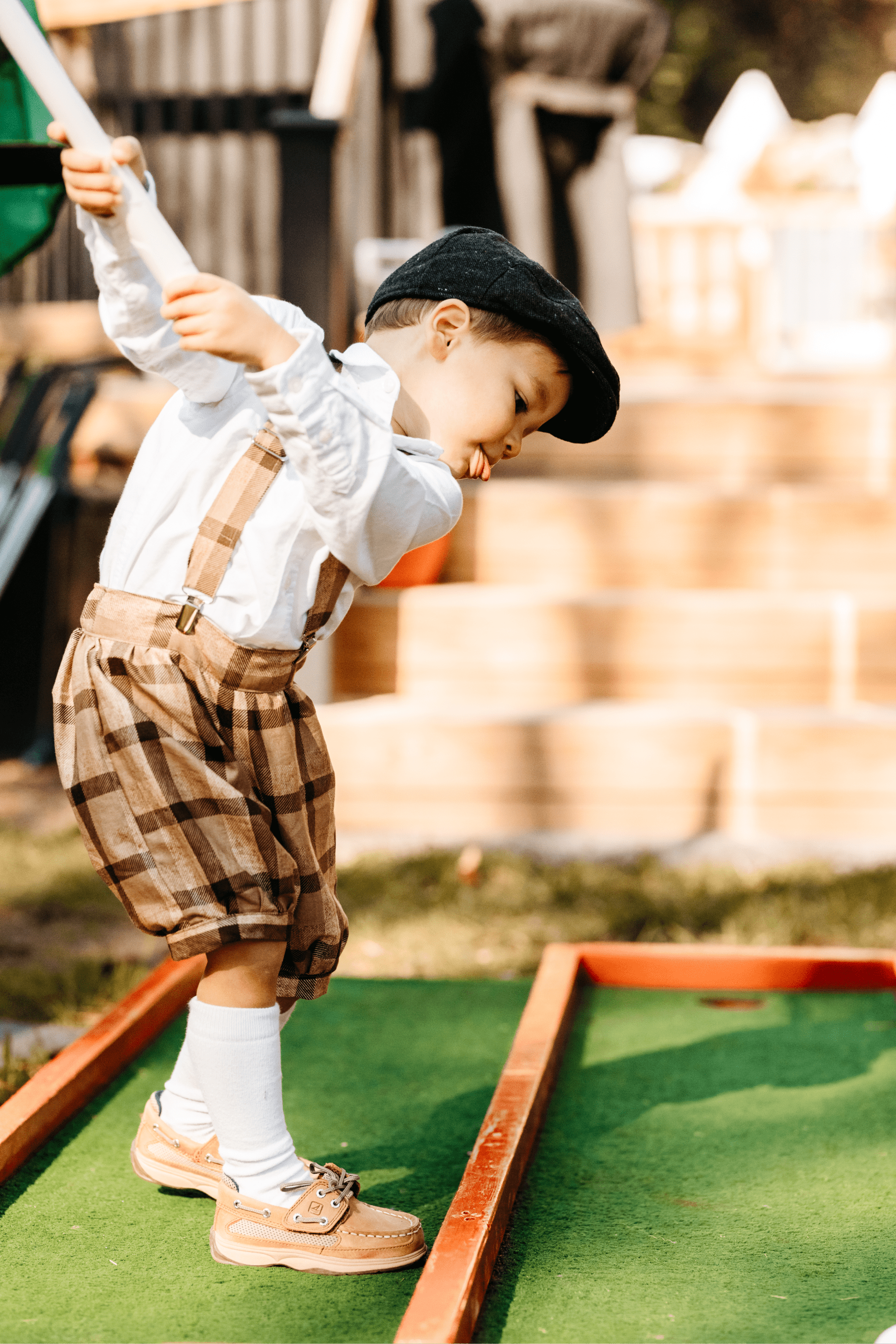 Close-up of the birthday boy golfing.