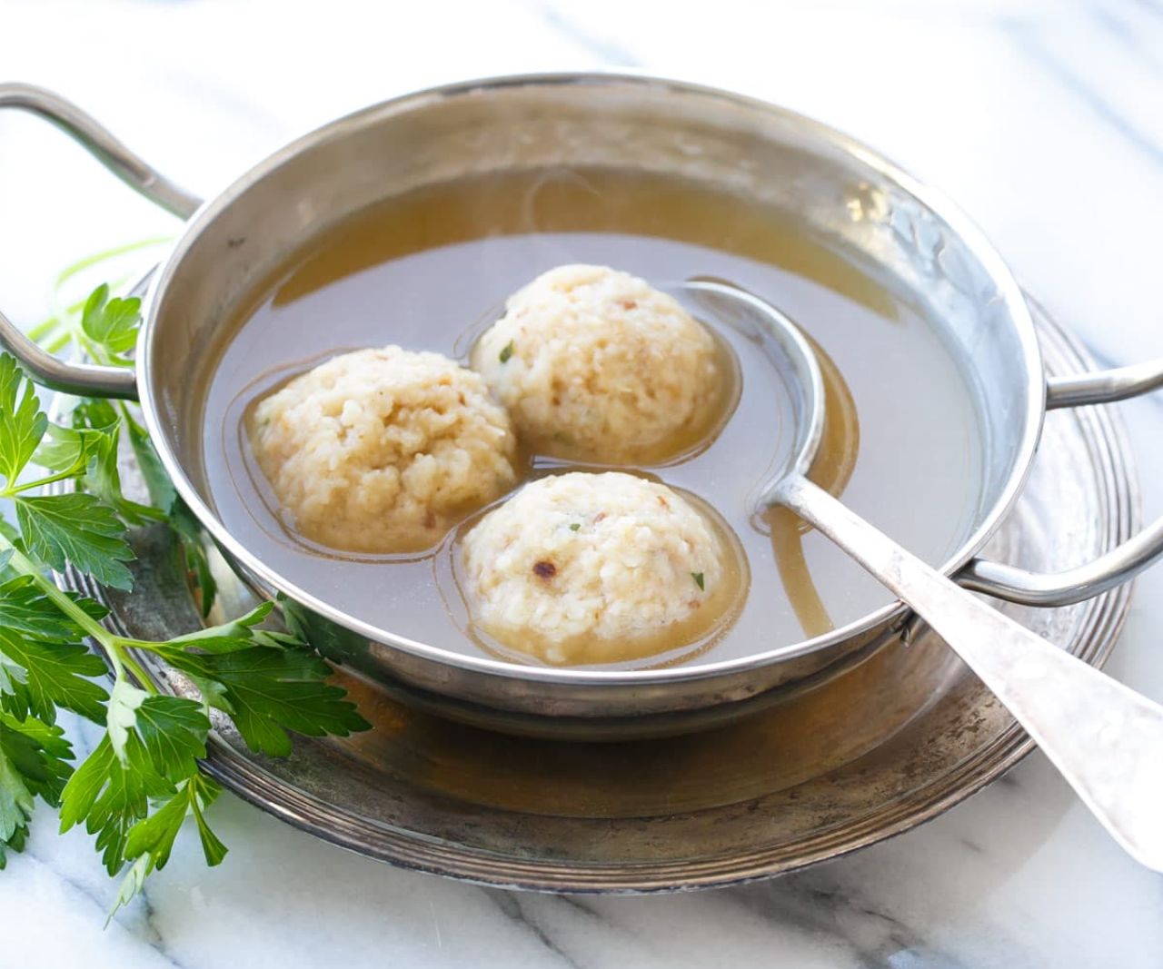 A bowl of matzo ball soup.