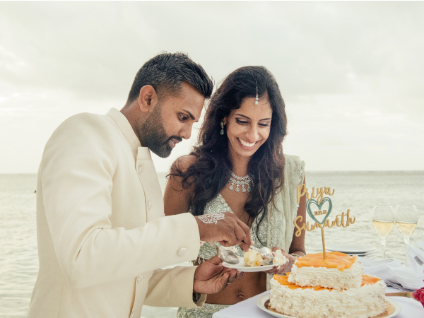 Priya and Sumanth sharing a piece of cake.