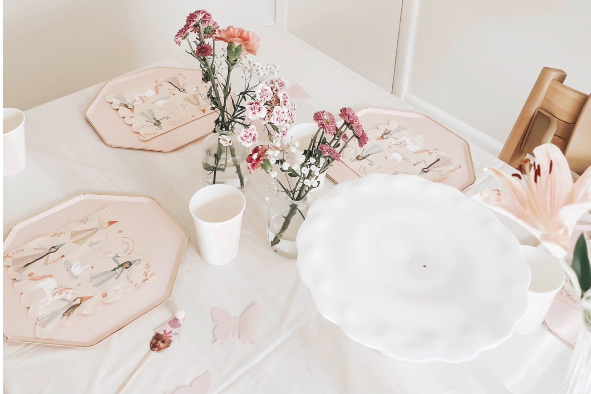 A pink birthday tablescape for a fairy-themed party.