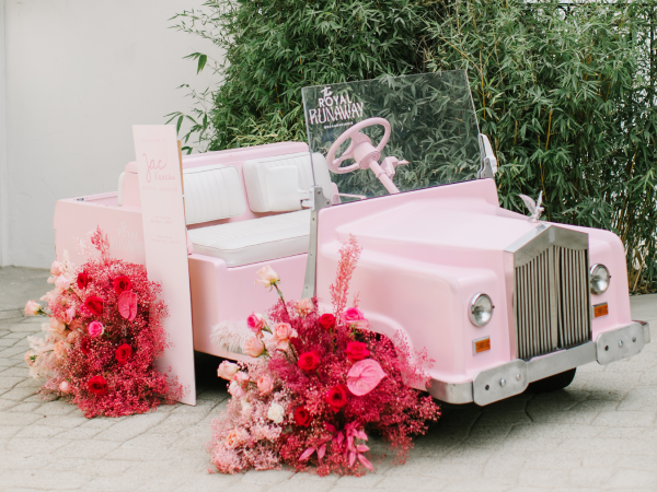 A pink vintage car.