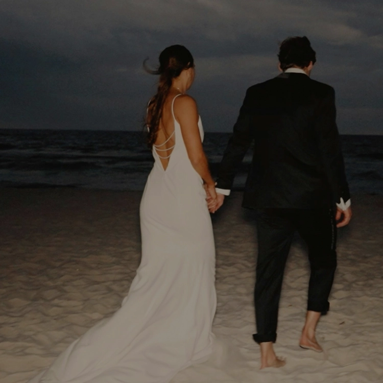 Photo of bride and groom on the beach