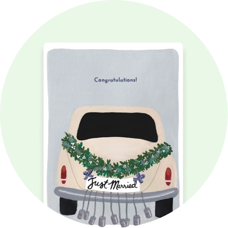 An upload-your-own media graduation card that has the text "congrats to our graduate" in white script over a full-bleed photo of a smiling graduate.