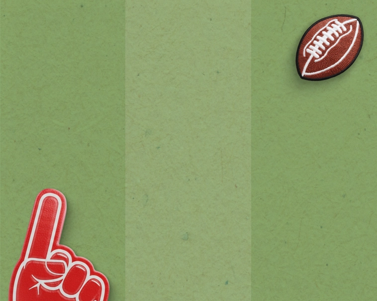 A green striped background with a football and foam finger motif.