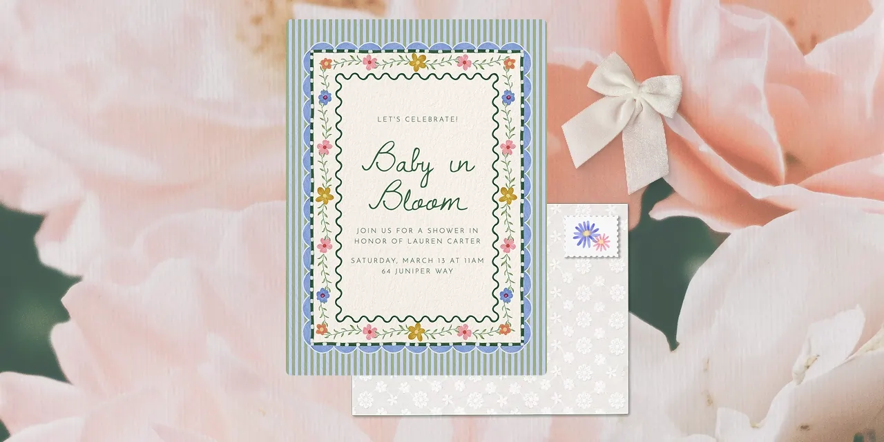 A floral baby shower invitation with striped and scalloped accents. 