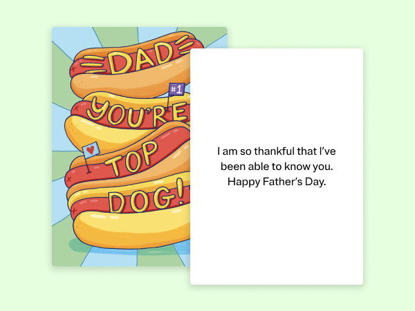 Hot dogs on a greeting card that says "Dad you're top dog!" on it.