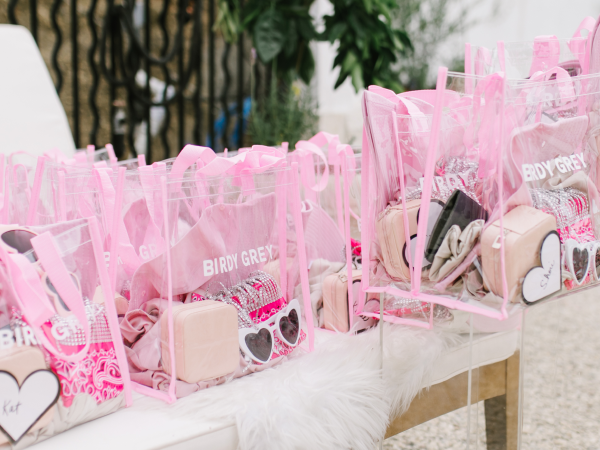 A table with goodie bags from Birdy Grey.
