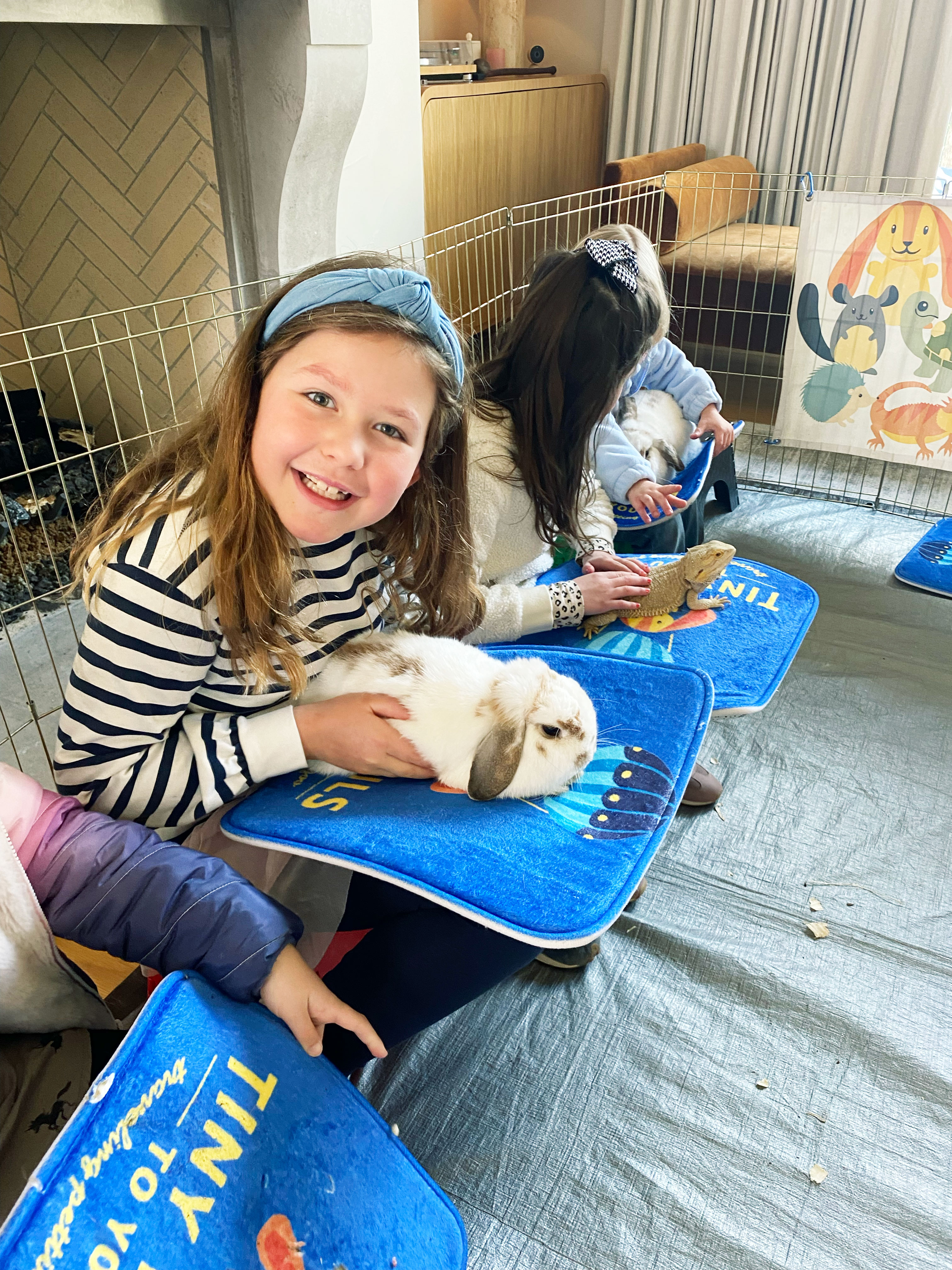 Kids enjoying the petting zoo at the party.